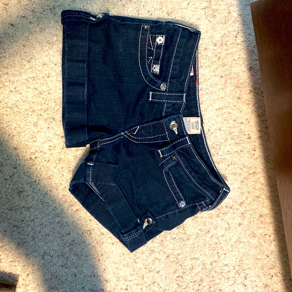 True Religion shorts in size 26. Dark blue, rhinestone, and cuffed.